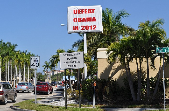 About 60,000 drivers will pass the sign every day.