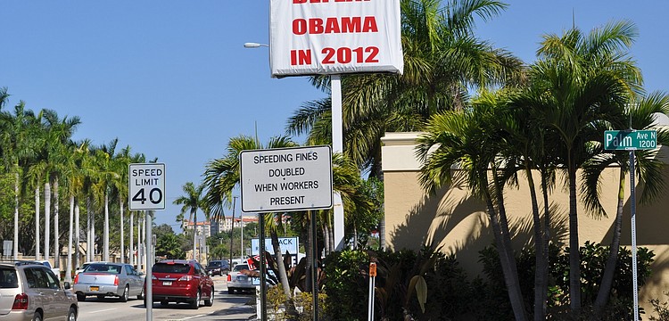 About 60,000 drivers will pass the sign every day.
