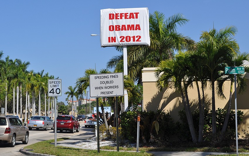 About 60,000 drivers will pass the sign every day.