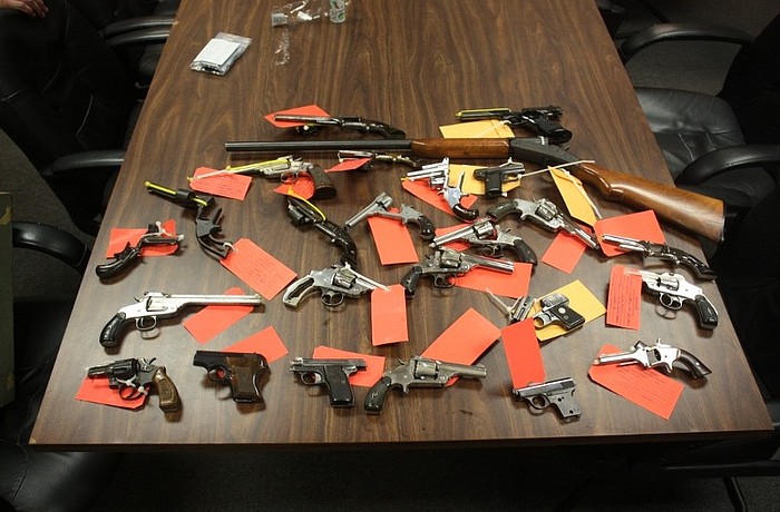 The search found 24 handguns and one shotgun