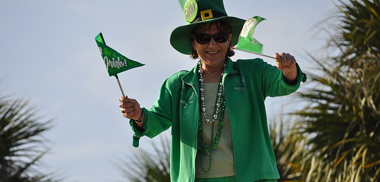 Tara Elementary School Principal Dr. Linda Fouse dressed up like a leprechaun this morning and welcomed students to school from a rooftop as a reward to students for raising more than $1,000 for children with muscular dystrophy.