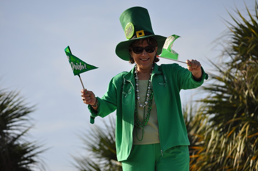 Tara Elementary School Principal Dr. Linda Fouse dressed up like a leprechaun this morning and welcomed students to school from a rooftop as a reward to students for raising more than $1,000 for children with muscular dystrophy.