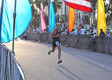 Seventh-place runner Jeff Lessie approaches the finish line.
