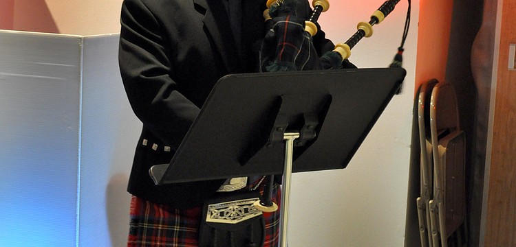 Father Dave Cottingham played traditional bagpipe songs.
