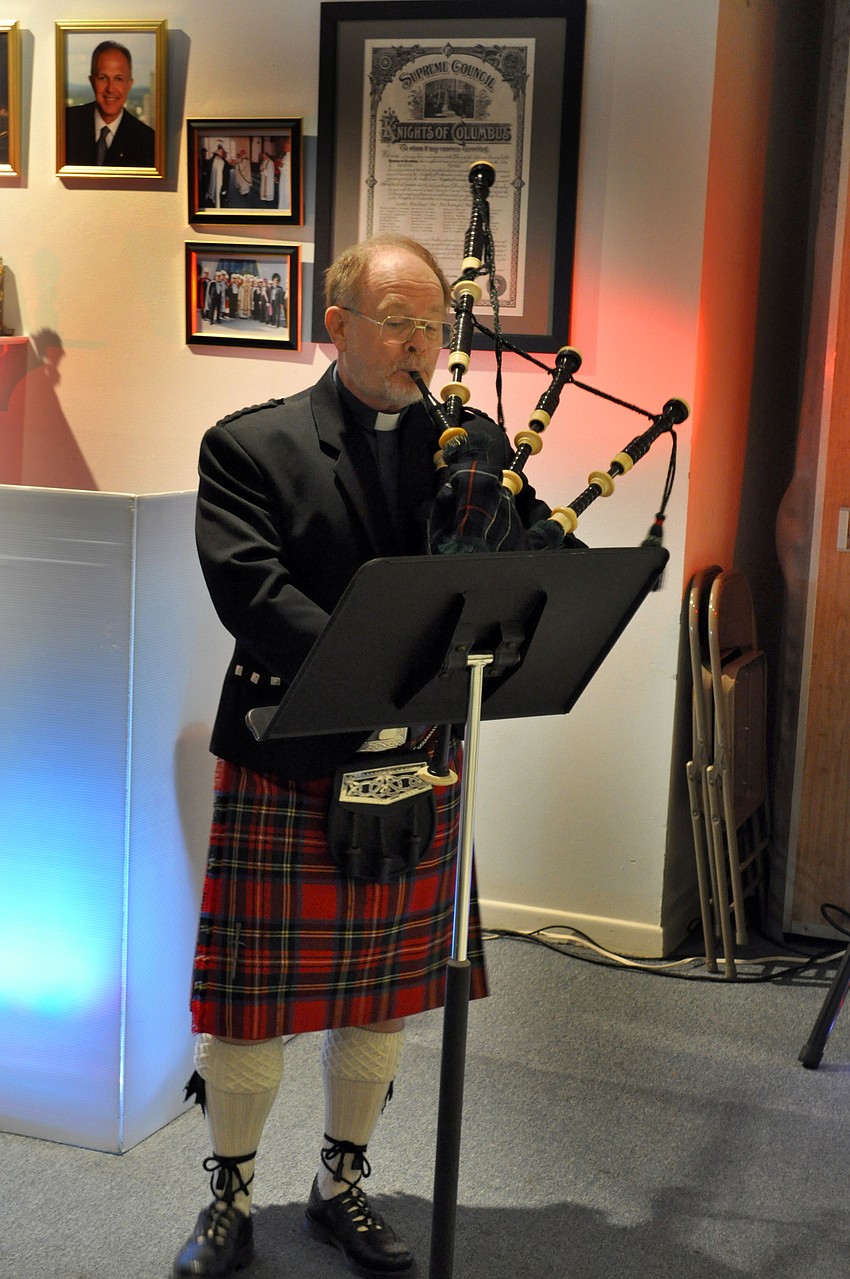Father Dave Cottingham played traditional bagpipe songs.