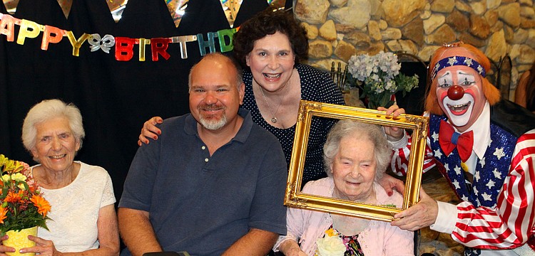 Rose Jones, John Jones, Elizabeth Jones, Elizabeth Delaney and Chuck Sidlow pose together, Monday, March 12, during Delaney's 109th birthday party.