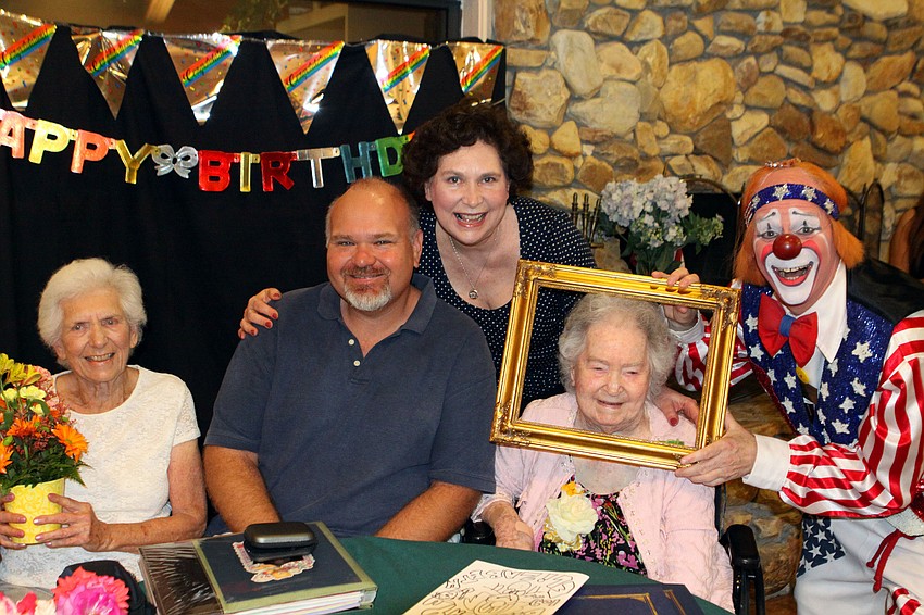 Rose Jones, John Jones, Elizabeth Jones, Elizabeth Delaney and Chuck Sidlow pose together, Monday, March 12, during Delaney's 109th birthday party.