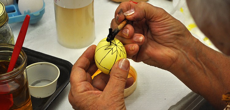 Tetiana Silecky adds another design to her Pysanka, "written egg".