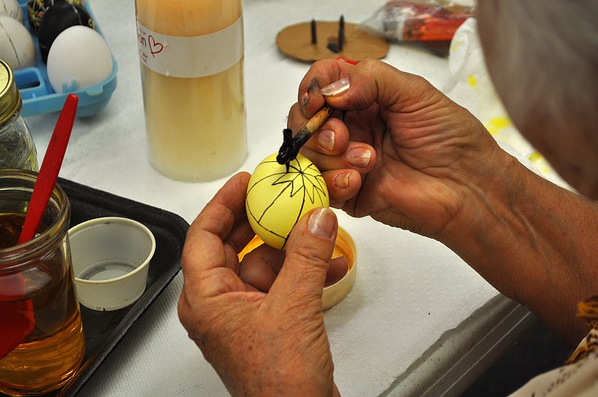 Tetiana Silecky adds another design to her Pysanka, 