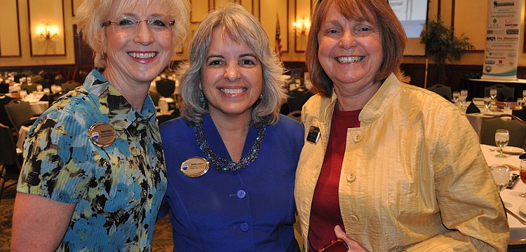 Terri Ayers and Marie Avery, of RE/Max Alliance Group, with Vicki Vega, of the Sarasota Chamber of Commerce