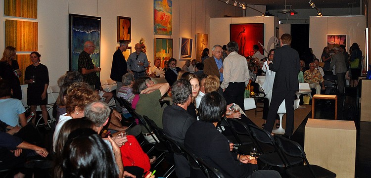 A large crowd filed into the State of the Arts Gallery, Thursday, March 15 for the 10x10 event.