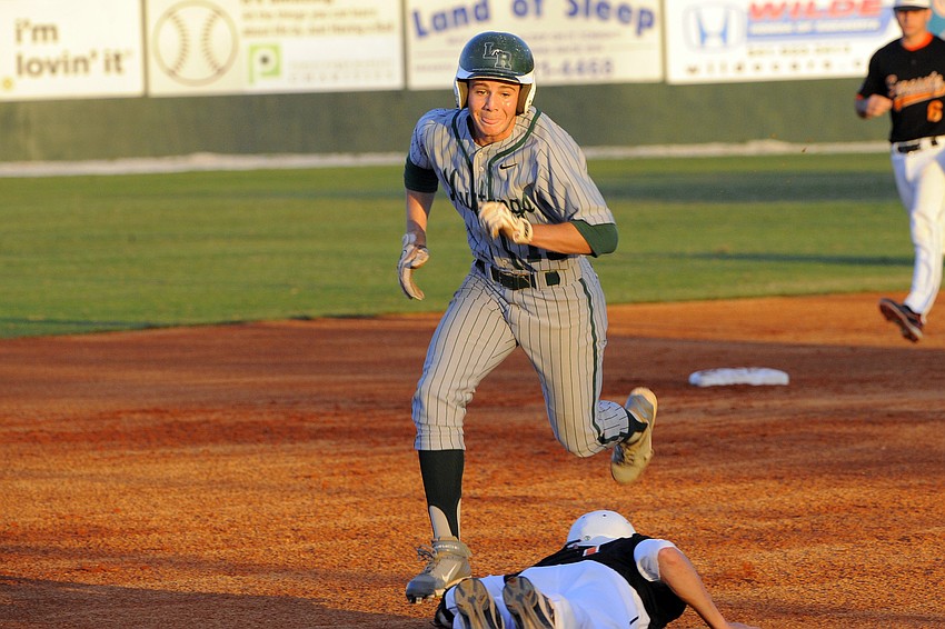 Lakewood Ranch senior Mike Lolli heads for third base during the Mustangs game against Sarasota.