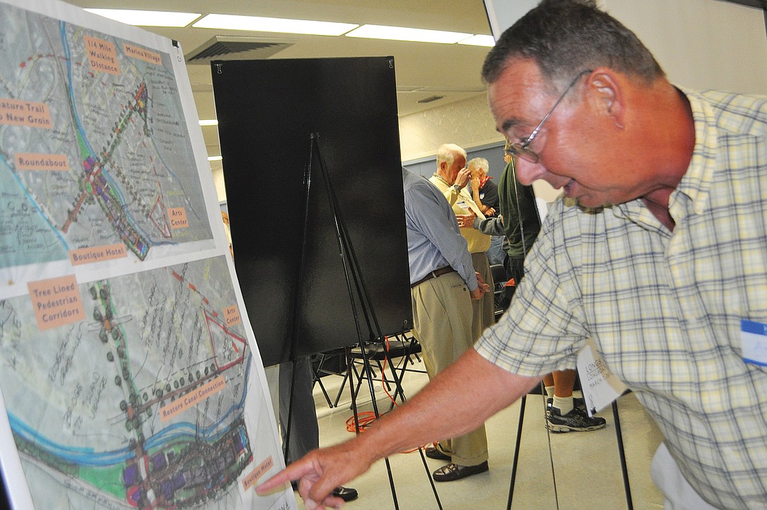 Art Tankersley checks out sketches of concepts for Longboat Key's north end.