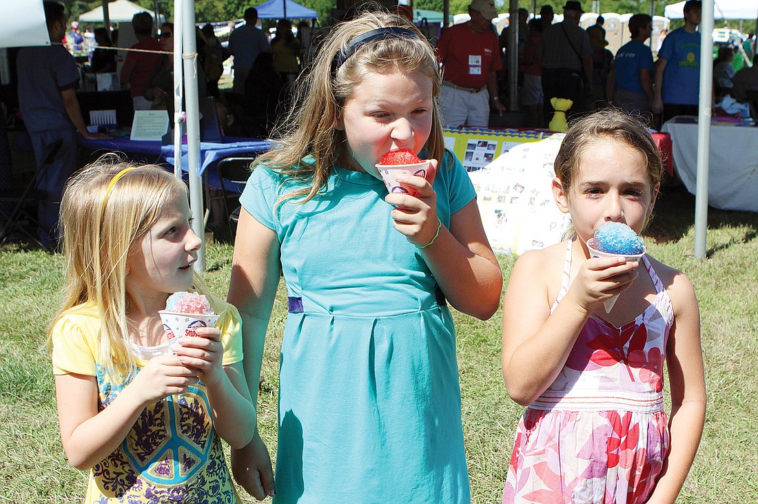 Julia Andrew, 6, Fiona Coffey, 9, and Myah Mattison, 6, enjoyed their sno-cones at last yearÃ¢â‚¬â„¢s SpringFest.