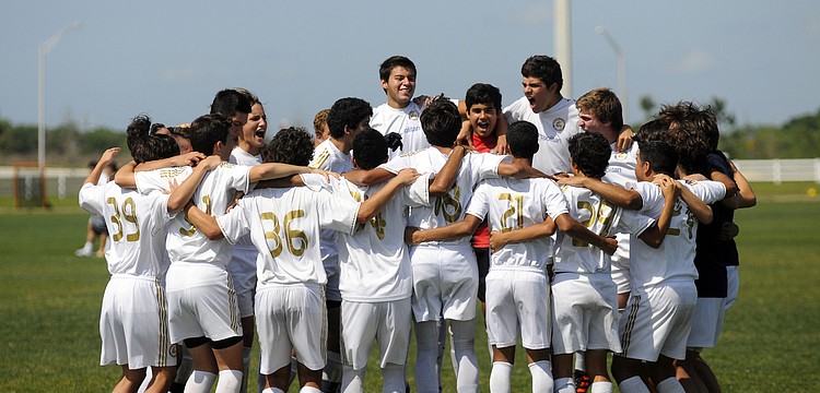 The Real Madrid Castilla U16 team pumps itself up before the start of its match versus IMG Soccer Academy.