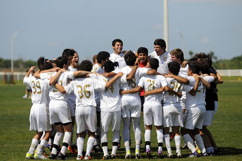 The Real Madrid Castilla U16 team pumps itself up before the start of its match versus IMG Soccer Academy.