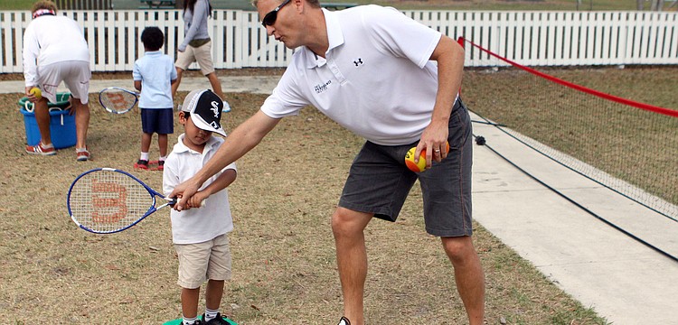 Mirai Mehta, 4, gets some pointers from Coach Scott Treibly.