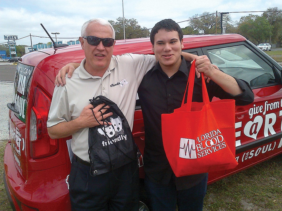 John Gilliss, owner of Friendly KIA of New Port Richey, presented Jeremiah Blalock with his new car.