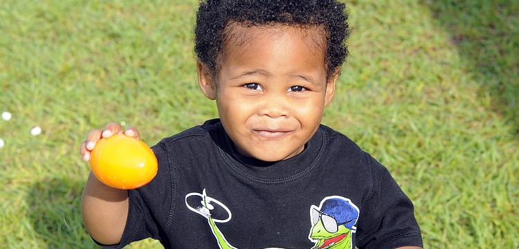 Uriah Long, 17 months, enjoyed showing off his orange Easter egg.