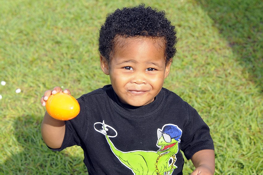 Uriah Long, 17 months, enjoyed showing off his orange Easter egg.