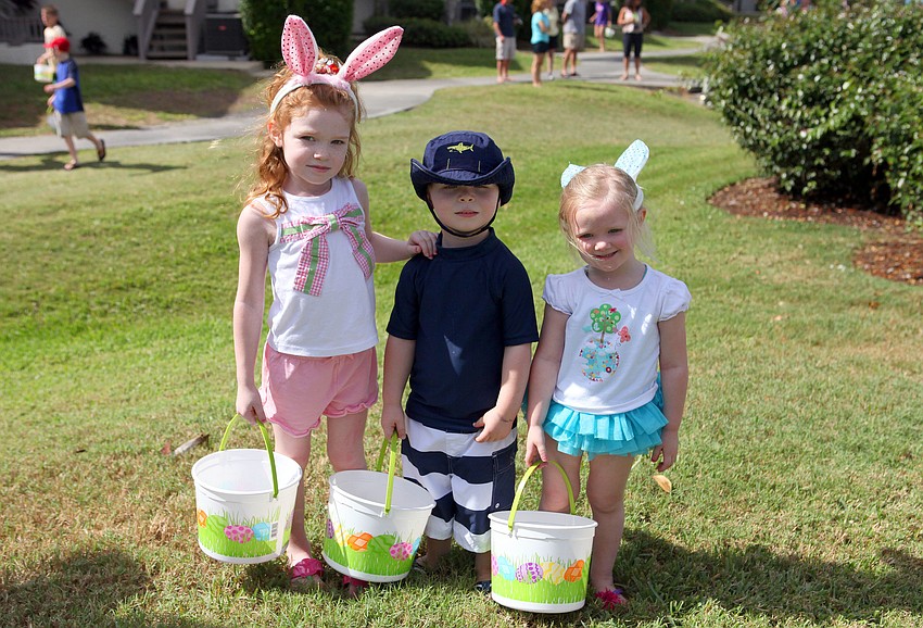 Suzanne MacMichael, 5, Brennan Carmichael, 3, and Meghan MacMichael, 3