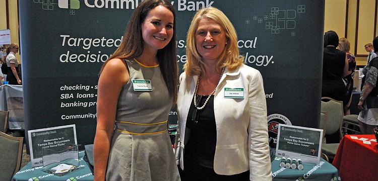Lauren Boyle and Sue Abbott both work for Community Bank, which will become C1 Bank May 1.
