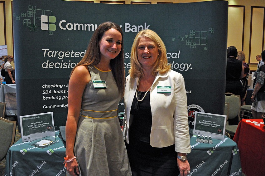 Lauren Boyle and Sue Abbott both work for Community Bank, which will become C1 Bank May 1.