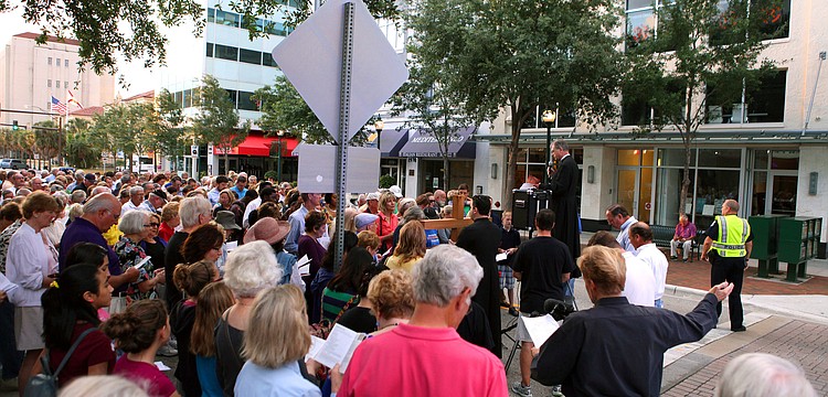 A large crowd came out for the Church of the Redeemerâ€™s 16th Annual Good Friday Stations of the Cross walk, Friday, April 6, down Main Street.