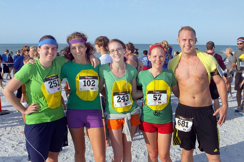 Ashley James, Christine Conley, Maleah Howell, Jamie Buckingham and Jack Joy dressed up as the cast of â€œTeenage Mutant Ninja Turtlesâ€, for the Turtle Run, Saturday, April 7, on Siesta Key Beach.