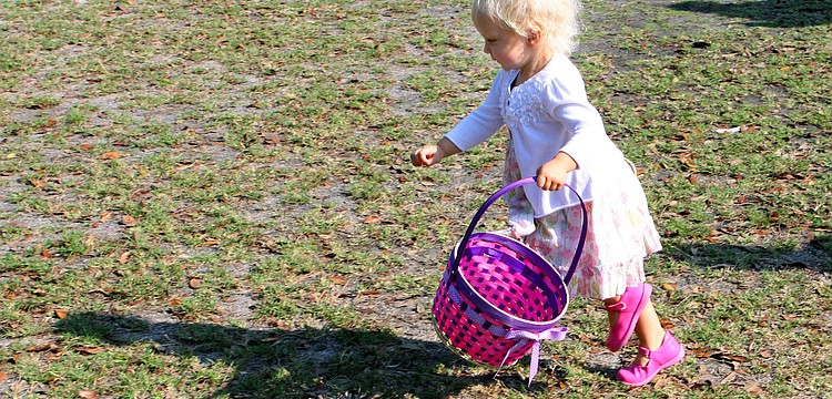 Mathilde Wesson, 2, was off and running to collect Easter eggs, Saturday, April 7, at St. Michael the Archangel.