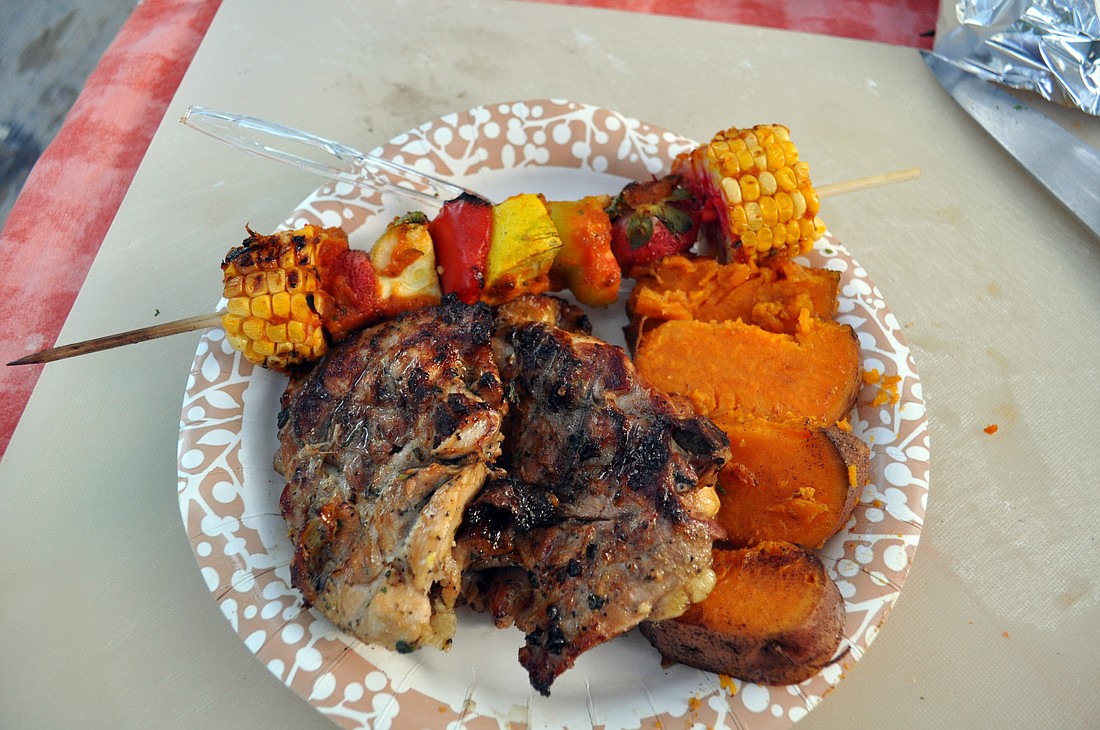 Barbecued chicken recipe, with sweet potatoes and grilled vegetable skewers topped with a spicy papaya sauce.