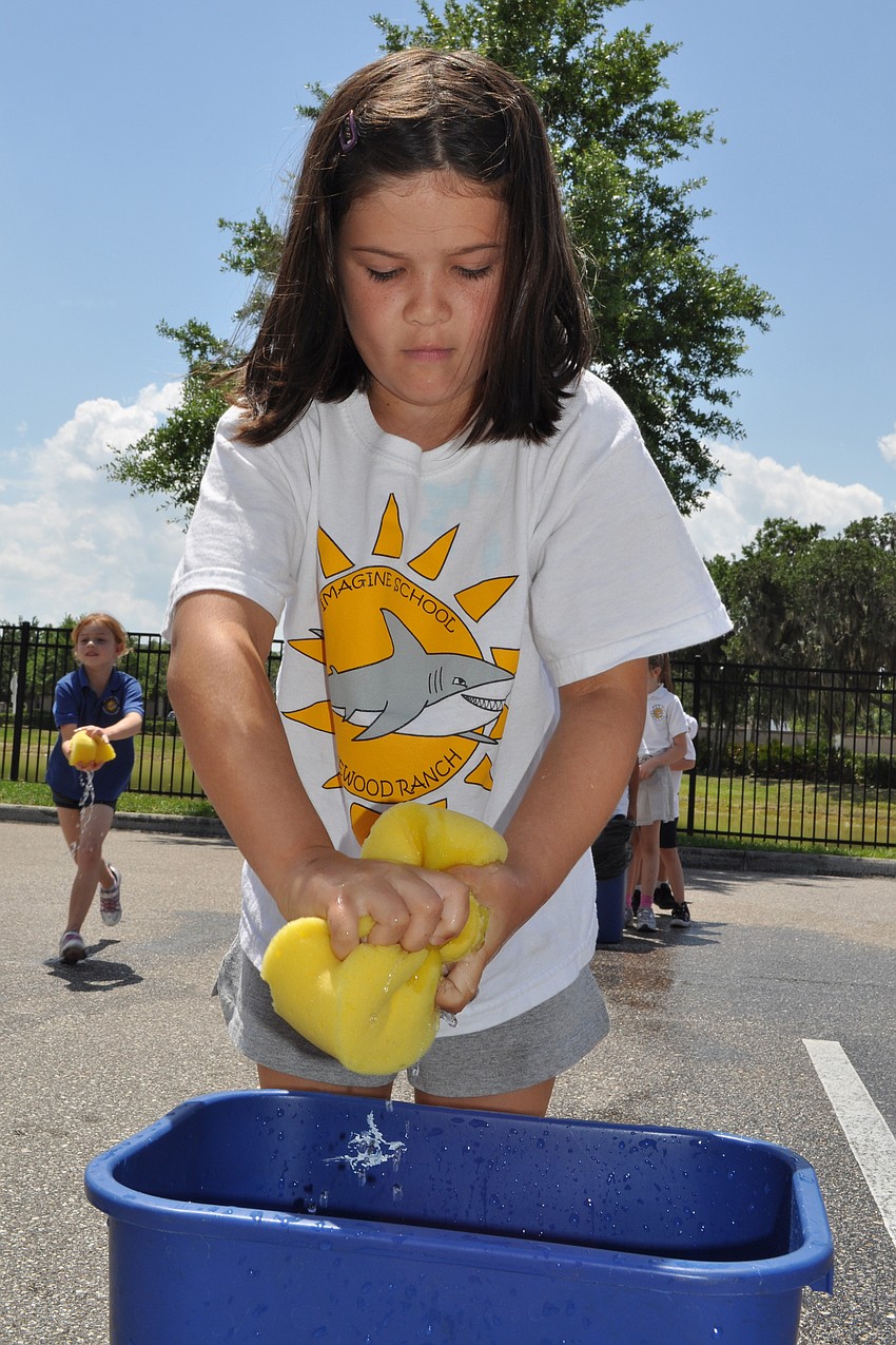 Reagan Baker squeezed the sponge as fast as she could for her team.