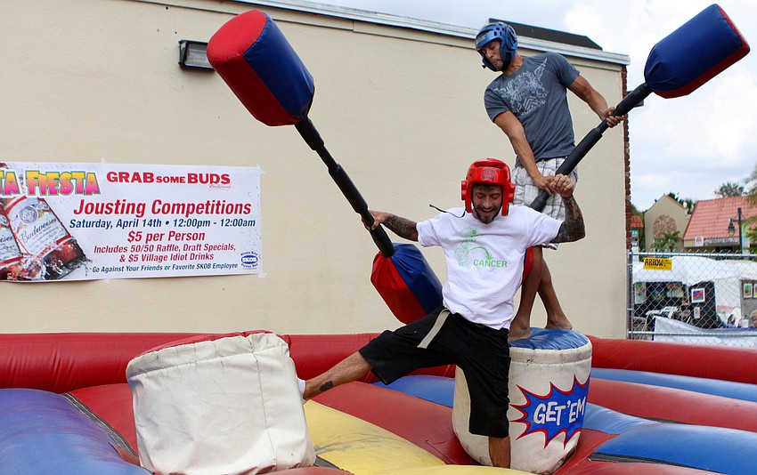 Douglas Jennings, chef at SKOB, goes down after being jousted off his post by Evan Fernandez.