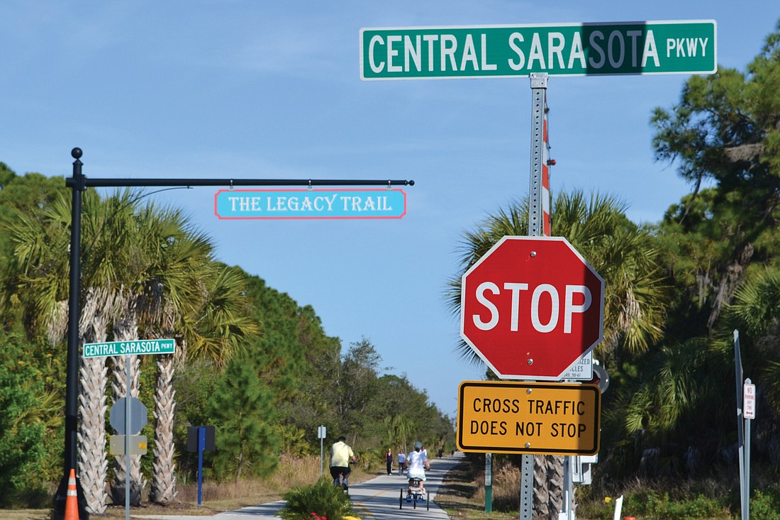 Bicyclists are now required to stop and wait for traffic to clear before crossing Central Sarasota Parkway on The Legacy Trail. File photo.