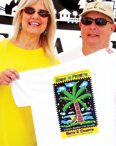 Catherine and Bob Luckner show off the shirts. Courtesy photo.