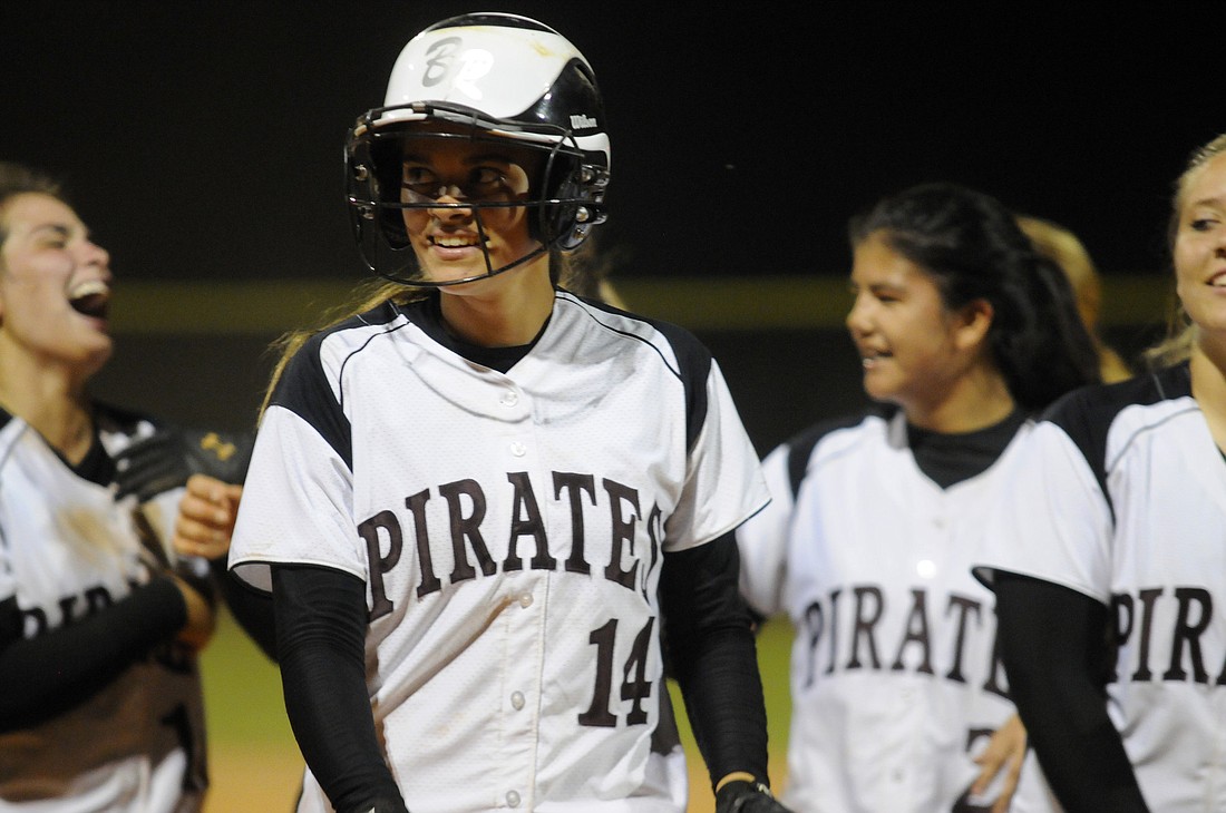 Braden River High senior Elena Lopez is congratulated after driving in the game-winning run in the bottom of the eighth inning.