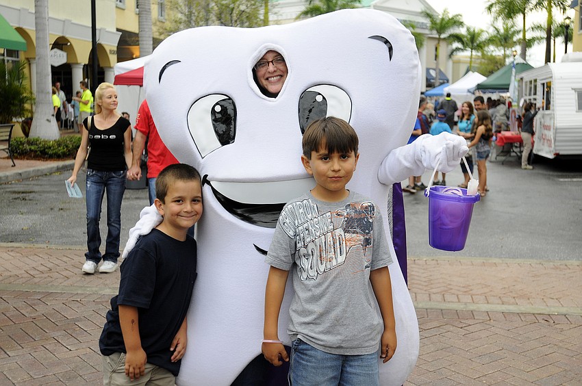 Six-year-old Andrew Boudreau and his older brother Matthew, 8, enjoyed a visit with Orthodontists of Lakewood Ranchâ€™s Super Tooth.