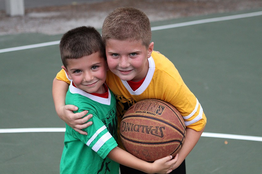 Alex, 5 Â½, and Nicholas, 9, Hefti have fun at Healthy Kids Day.