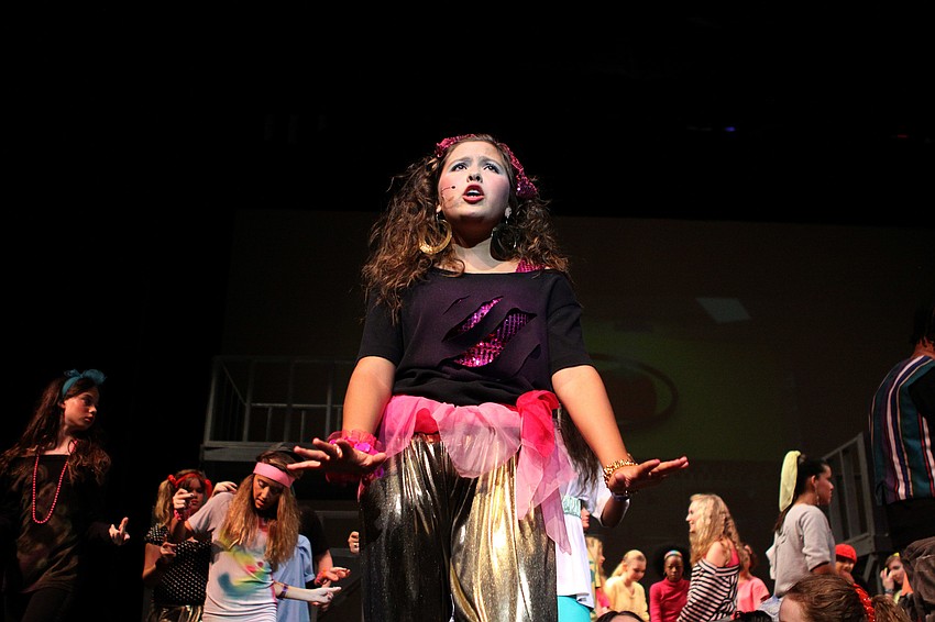 Carmen Diaz, played by Pamela Kurpiewski, 7th grade, sings while the company backs her up during â€œThere She Goes/Fameâ€.