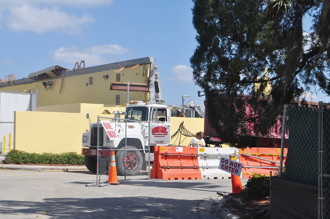 Demolition of the old Publix building was under way Monday afternoon. The store first opened in June 1980.