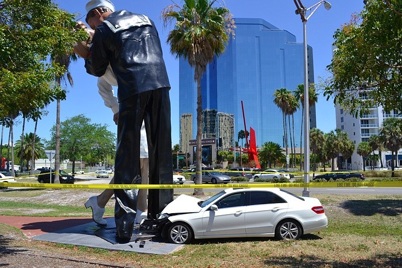 One witness said the car was traveling about 30 mph when it came over the bushes and somehow avoided southbound traffic before taking aim at the statueÃ¢â‚¬â„¢s legs.