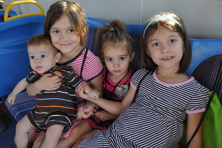 Oliver, Caitlyn, Sarala and Ally Ryherd were eager to explore the bus.