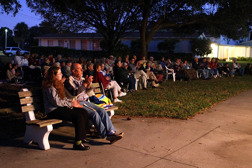 The crowd claps after one of Cheryl Losey's pieces during 