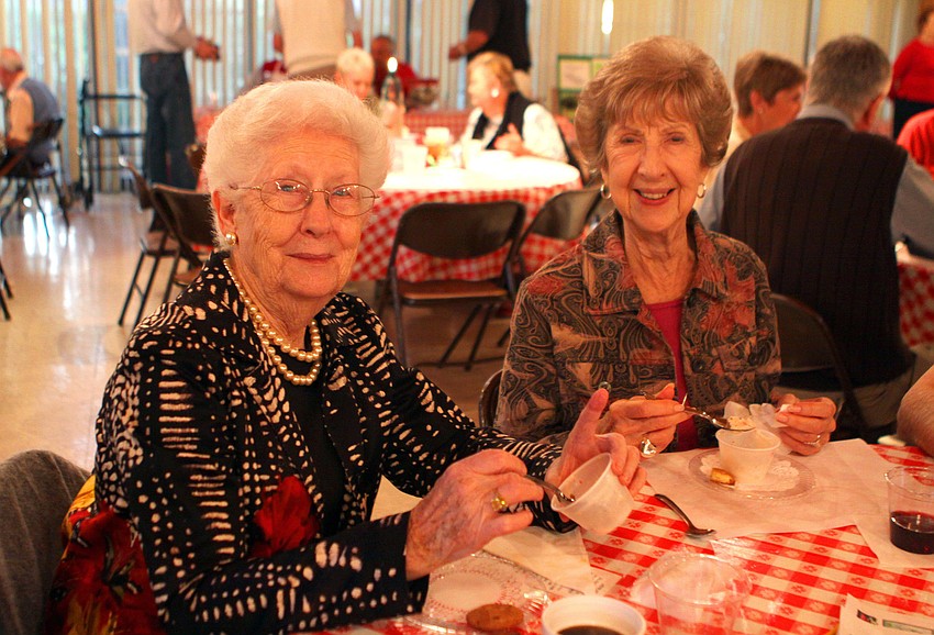 Martia Thompson and Nita Sebens enjoy their spumoni dessert at the spaghetti dinner, Saturday, Jan. 7 at the Sarasota Garden Club.