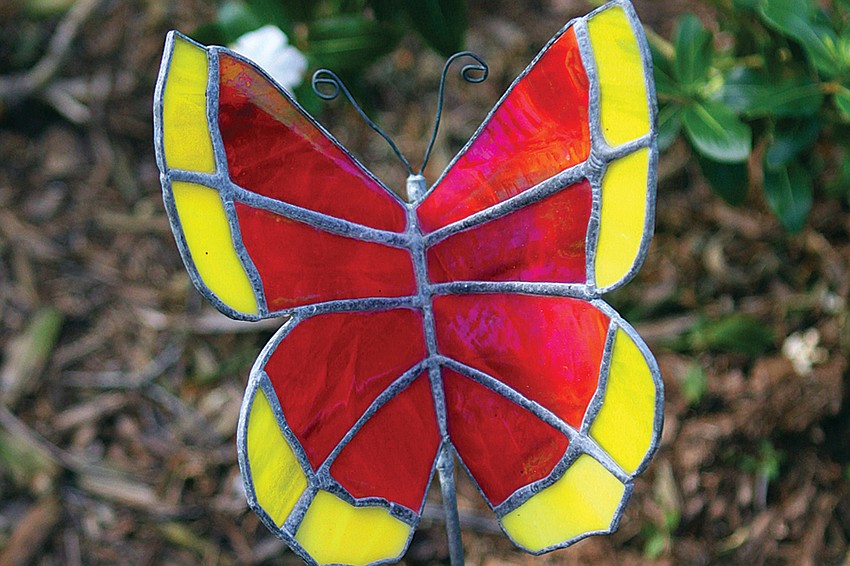 Olivia Haynes enjoys creating stained glass, butterfly lawn ornaments and putting them throughout her yard.