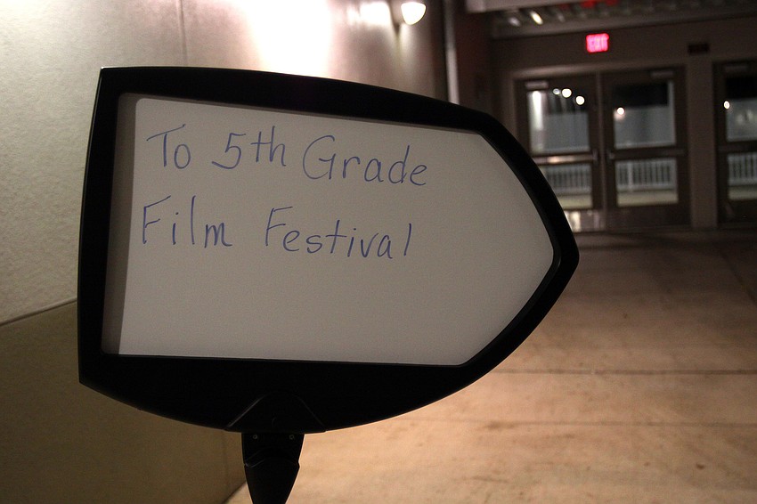 A whiteboard sign pointed the way to the film festival.