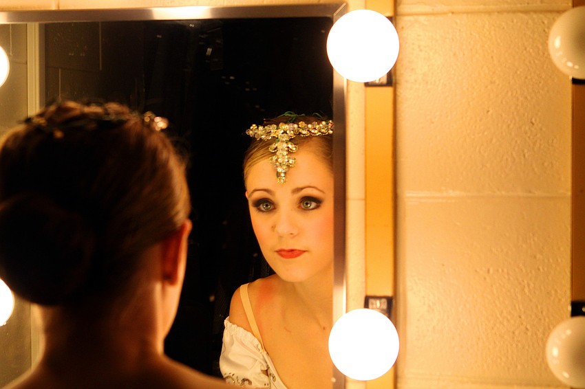 Kayleigh Likens, 15, gets on last look at herself in the dressing room mirror before heading out to perform her final piece, Saturday, Jan. 21, at the Youth America Grand Prix at the Straz Center in Tampa.
