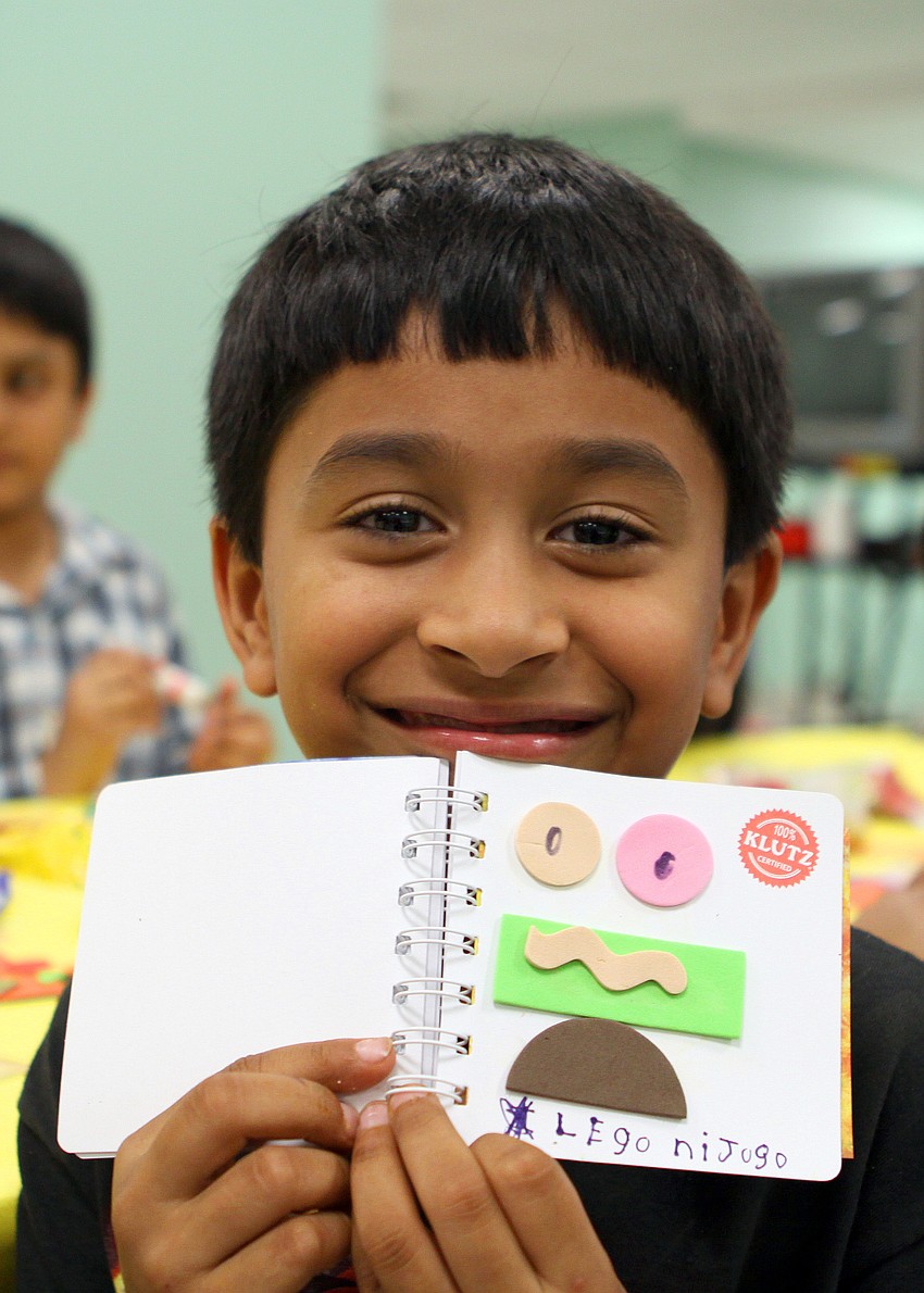 Ohm Patel, 6 shows off the book he made, Wednesday, Jan. 25, during Bay Haven's Build a Book night.