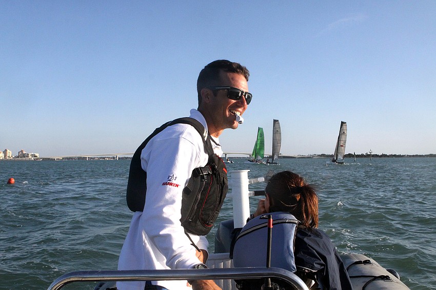 Bryan Paine uses a whistle to get the attention of the sailors during practice, Monday, Jan. 30.