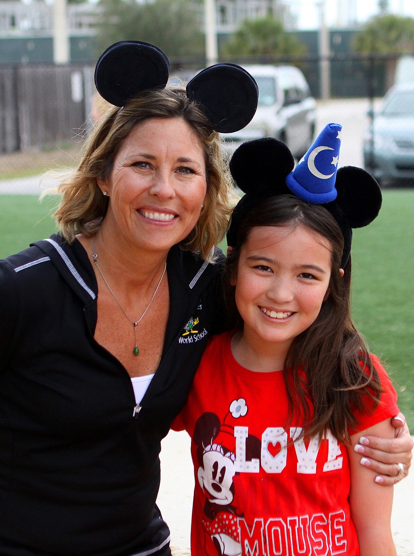 Mrs. Ginger Rosenberger and Molly Walter, 10, donned Mouse ears during Disney Day at Phillippi Shores Elementary.